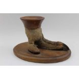 A taxidermy specimen of an Ostrich foot, mounted upon an oval oak base, having turned wood mount, ov