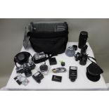 A large camera bag including Nikon 5700 camera, Samsung Gigimax D103