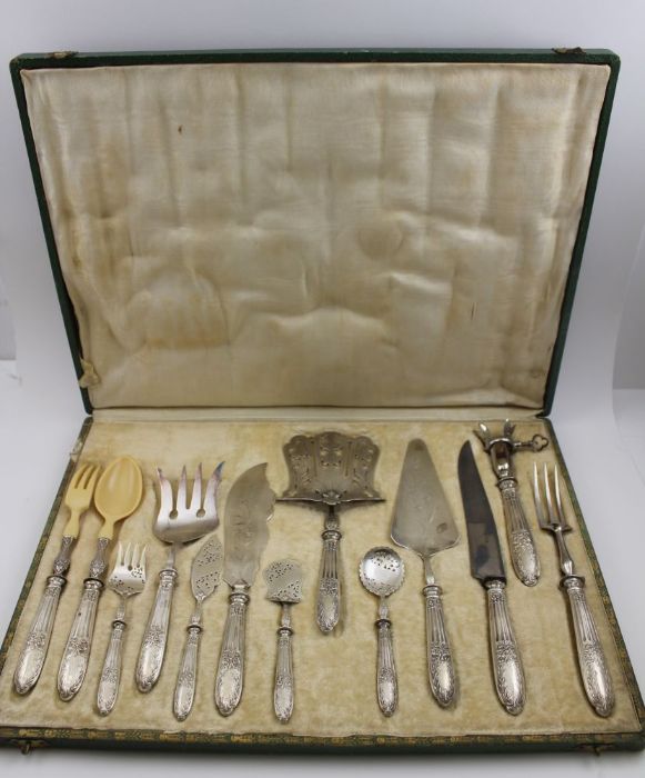 A cased set of thirteen French serving pieces with silver handles, Minerva marks