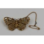 A 15ct gold butterfly design brooch, inset seed pearls, 4cm, gross weight: 5.4g, fitted with safety