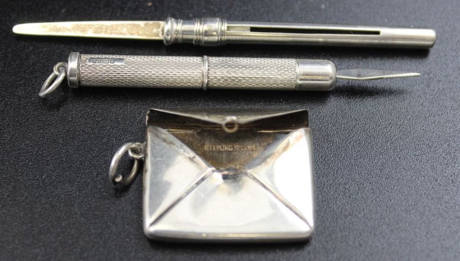 Two silver trowel bookmarks, silver stamp case, silver paper clip, and two silver toothpicks - Image 3 of 3