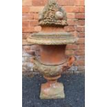 A Classical design terracotta Camparna urn, fitted two handles, egg & dart rim on square base, fitte
