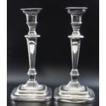 A pair of Victorian silver plated candlesticks, Adam design with gadroon borders