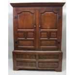 A late 18th century Estate cupboard later adapted two piece oak, the upper section with paneled door