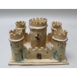 A 20th century studio pottery castle, with turrets and battlements, the base 19cm x 25cm