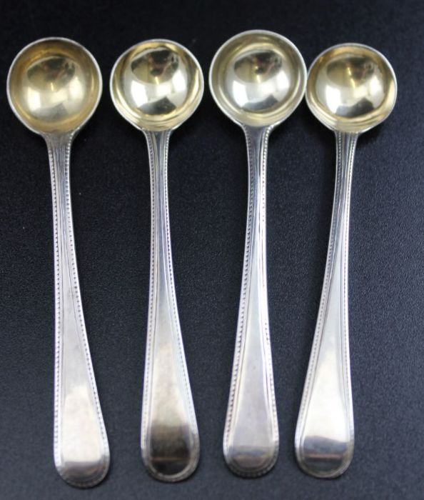 Two pairs of George III matching beaded edge salt spoons, one pair by Charles Hougham,