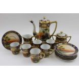A Noritake ceramic coffee set for six, hand painted sunset river landscape decoration, gilded, compr