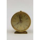 A Jaeger Recital 8 brass cased travel clock, 4cm in diameter