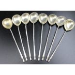 A set of eight Russian silver tea stirrers, engraved bowls with monogram "C" 84 mark combined weight