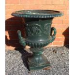 A pair of early 19th century Regency cast iron garden planters, fluted urn form with egg & dart rims