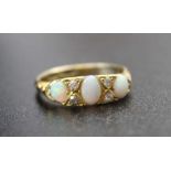 An 18CT gold opal and diamond set ring Q.5 size