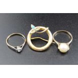A 9ct gold solitaire diamond ring, a 9ct gold ring mounted with a pearl, and a 9ct gold circular bro