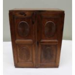 A 19th century mahogany cabinet fitted two doors with sunburst panels