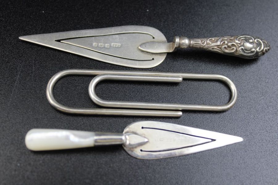 Two silver trowel bookmarks, silver stamp case, silver paper clip, and two silver toothpicks - Image 2 of 3