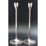 A pair of modernist silver plated candlesticks designed by Vera Wang for Wedgwood, the bases having