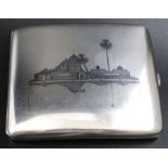An Iraqi Niello white metal cigarette case, decorated with river scenes to either side, 8cm x 9cm,