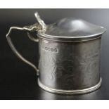 A Silver William IV mustard pot, engraved decoration, falcon crest London 1833 complete with blue gl