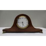 An Edwardian mahogany hat clock, circular dial with Arabic numerals, 8cm in diameter, raised on bras