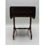 An early 19th century mahogany sewing table, fitted drawers, twin flaps on trestle supports, 49cm x