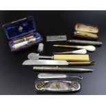 Two Victorian cased silver mounted cigarette holders, together with two silver pencils, cigar amel f
