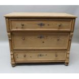 A 19th century pine chest of three long drawers, decoratively moulded sides, 97cm wide