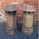 A pair of stoneware chimney pots with octagonal tops, and flared stems, 75cm high