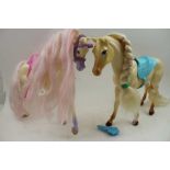 A large collection of dolls clothes, a Baywatch model jet ski, two model play horses
