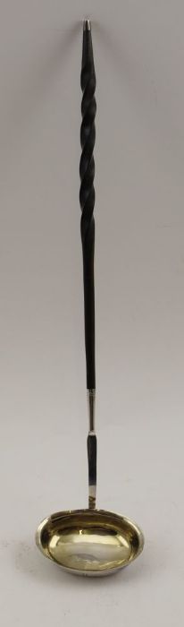 A George III silver toddy ladle, with gilded interior, having twisted whale bone handle, London 1818