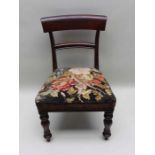 A William IV mahogany child's single chair, wool-work seat