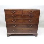 A late 18th century oak six drawer chest, retaining period swan neck handles