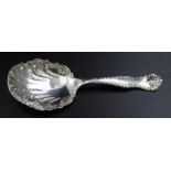 A Victorian silver tea caddy spoon, decoratively cast, scallop form bowl, Birmingham 1899, 19g