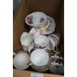 A box of china tea cups & saucers in pink rose pattern