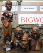 A collection of African heads & a figure (4)