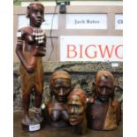 A collection of African heads & a figure (4)