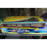A boxed micro Scalexric, mini challenge race game, together with a boxed Trix twin cadet railway