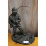 A resin figure of a Fly Fisherman