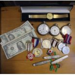 A bag of three pocket watches, wristwatch, three pen knives, medals & bank notes