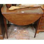 A 19th century mahogany oval topped Pembroke table, fitted single cutlery drawer on four square tape