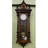 A late 19th /early 20th century walnut Vienese design wall clock with weights & pendulum
