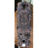 A carved wall mask
