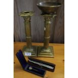 Pair of brass candlesticks, scales and a fox mask tie pin