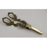 A pair of gilded metal grape shears, cast fruiting vine decoration