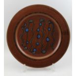 A glazed studio Winchcombe pottery charger, bears studio impressed mark, 38cm in diameter