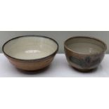 Two Winchcombe pottery bowls, 19.5cm in diameter, the other 26cm in diameter smaller with decorative