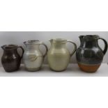 Two Winchcombe pottery glazed stoneware jugs, and two other studio glazed jugs