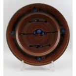 A Winchcombe glazed stoneware charger with blue decoration, 35cm in diameter