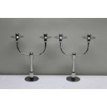 A pair of Robert Welch stainless steel "Brunel" candlesticks with twin sconces, 29cm high