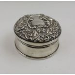 A Victorian design silver jewellery casket, embossed hinged lid, with green man and bird decoration,