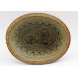 A glazed stoneware jelly mould, with lion impression, 18cm x 14cm