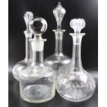 Four various glass decanters with stoppers, the tallest 35cm